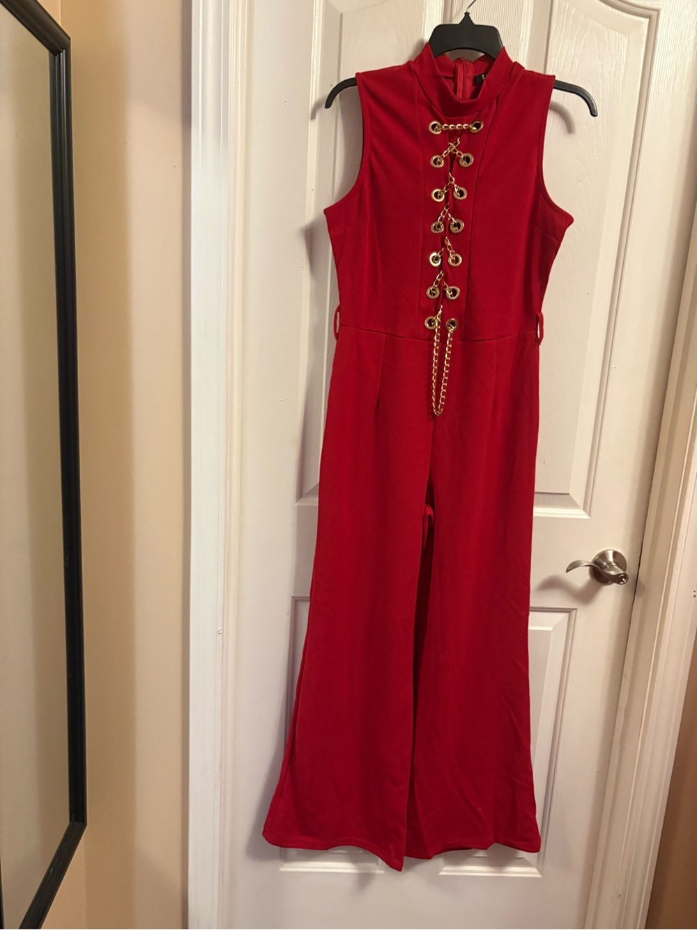 Sleeveless Red Jumpsuit with Lace-Up Gold Chain Detail